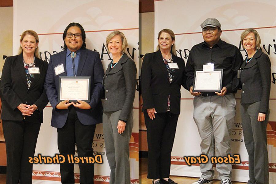 Edson Gray and Darrell Charles shown with representatives from NM Gas Company and their awards.